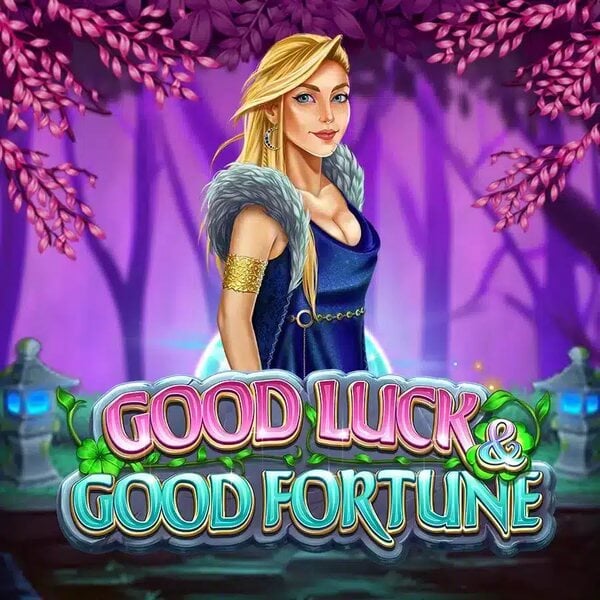 Fantasy-themed illustration of a blonde woman in a blue dress with fur accents and gold jewelry, standing in a mystical forest with pink blossoms. The text 'Good Luck & Good Fortune' is prominently displayed in bold, colorful letters below her