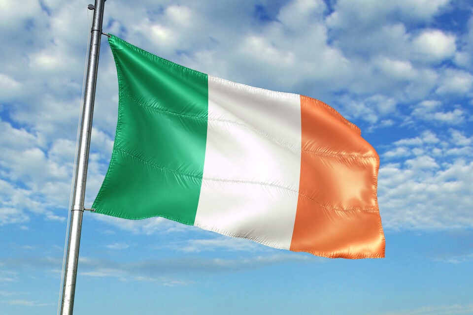 Irish flag against a blue sky