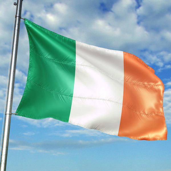 Irish flag against blue sky