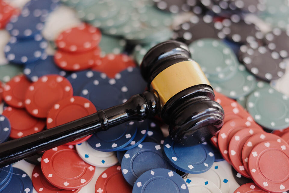 Judicial gavel and casino chips on the table. Gambling regulation and rules concept. stock photo