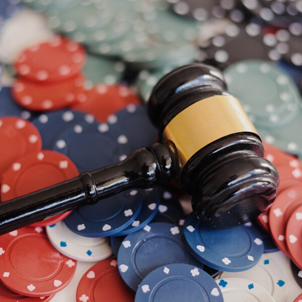 Judicial gavel and casino chips on the table. Gambling regulation and rules concept. stock photo